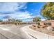 Inviting community entrance with manicured landscaping and signage at 904 Melic Way, North Las Vegas, NV 89032