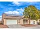 Inviting single-story home featuring neutral tones, solar panels, and an attached two-car garage at 904 Melic Way, North Las Vegas, NV 89032
