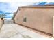 View of the side exterior, including a long driveway and access gate at 904 Melic Way, North Las Vegas, NV 89032