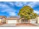 Charming single-story home with a well-manicured yard, solar panels, and a two-car garage at 904 Melic Way, North Las Vegas, NV 89032
