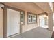 Inviting front porch area with a white door and trim, offering a welcoming entrance to the home at 904 Melic Way, North Las Vegas, NV 89032