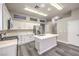 Stylish kitchen featuring white cabinets, stainless steel appliances, and a functional center island at 904 Melic Way, North Las Vegas, NV 89032