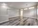 Neutral living room with light grey wood floors, providing a clean and modern space at 904 Melic Way, North Las Vegas, NV 89032