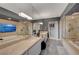 This primary bathroom offers dual vanities, a glass enclosed shower, and a separate soaking tub at 9101 Alta Dr # 11, Las Vegas, NV 89145