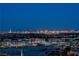 Stunning city skyline view at night with distant building lights and a parking lot in the foreground at 9101 Alta Dr # 11, Las Vegas, NV 89145
