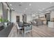 The dining area features a modern table and chairs, accented by stylish wall decor, and an open view to the kitchen at 9101 Alta Dr # 11, Las Vegas, NV 89145