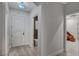 Bright entryway with light wood flooring, white walls and doors with an ornate front door design at 9101 Alta Dr # 11, Las Vegas, NV 89145
