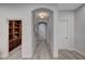 Hallway with access to library and other living spaces. Neutral wall paint at 9101 Alta Dr # 11, Las Vegas, NV 89145