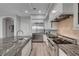 Updated kitchen featuring stainless steel appliances and granite countertops at 9101 Alta Dr # 11, Las Vegas, NV 89145