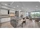 Open-concept kitchen and living area with a kitchen island and stainless steel appliances at 9101 Alta Dr # 11, Las Vegas, NV 89145