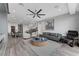 Open-concept space featuring a living room, dining area, and kitchen with modern fixtures and natural light at 9101 Alta Dr # 11, Las Vegas, NV 89145