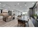 Open-concept living area featuring a kitchen with an island, dining area, and comfortable seating with a view at 9101 Alta Dr # 11, Las Vegas, NV 89145