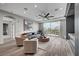 Living room featuring a comfortable seating arrangement, modern decor, and sliding glass doors to a balcony at 9101 Alta Dr # 11, Las Vegas, NV 89145