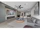 Modern living room featuring sleek furniture, a fireplace, and a large screen television at 9101 Alta Dr # 11, Las Vegas, NV 89145