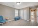 Bright bedroom featuring stylish furnishings, a closet, and seamless access to the hallway at 9347 Ardoa Ave, Las Vegas, NV 89148