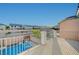 Balcony with a view of a community pool and surrounding neighborhood at 9601 Rolling Thunder Ave, Las Vegas, NV 89148