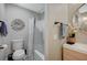 Bright bathroom with a tub shower, modern vanity, and decorative accents at 9601 Rolling Thunder Ave, Las Vegas, NV 89148