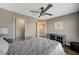 Cozy bedroom featuring a ceiling fan, neutral colors, and ample natural light at 9601 Rolling Thunder Ave, Las Vegas, NV 89148
