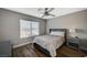 Bright bedroom features a large window and a comfortable bed with grey decor at 9601 Rolling Thunder Ave, Las Vegas, NV 89148