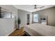 Inviting bedroom with a ceiling fan, modern decor, and natural light at 9601 Rolling Thunder Ave, Las Vegas, NV 89148