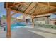 Backyard gazebo and pool provide a stunning view of the outdoor space featuring lounge chairs and a covered outdoor seating area at 9601 Rolling Thunder Ave, Las Vegas, NV 89148