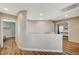 Bright hallway with wood floors and a unique curved wall at 9601 Rolling Thunder Ave, Las Vegas, NV 89148