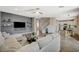Open concept living room featuring hardwood floors, modern decor, and smooth transition into kitchen at 9601 Rolling Thunder Ave, Las Vegas, NV 89148