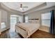 Spacious main bedroom featuring tray ceilings, recessed lights, and ample natural light at 9601 Rolling Thunder Ave, Las Vegas, NV 89148