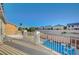 This home includes a spacious outdoor patio with beautiful views of the sparkling community pool at 9601 Rolling Thunder Ave, Las Vegas, NV 89148