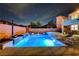 Stunning backyard pool and spa with water features, lounge seating, and an upper balcony, perfect for relaxation and entertainment at 9601 Rolling Thunder Ave, Las Vegas, NV 89148