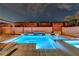 Stunning backyard pool and spa featuring a unique water feature and lounge area at 9601 Rolling Thunder Ave, Las Vegas, NV 89148