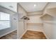 Spacious walk-in closet with ample shelving and natural light at 9601 Rolling Thunder Ave, Las Vegas, NV 89148