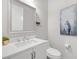 Bathroom featuring white vanity, white walls and a modern mirror at 1 Vicolo Bella, Henderson, NV 89011