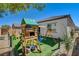 Backyard view featuring artificial turf and play area at 10064 Ocher Valley Ave, Las Vegas, NV 89178