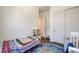Bright bedroom featuring a toddler bed, play kitchen, and ample storage, perfect for a  at 10064 Ocher Valley Ave, Las Vegas, NV 89178