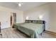 Bedroom with a door to an ensuite bathroom with stylish tiles in the shower and walk in closet at 10064 Ocher Valley Ave, Las Vegas, NV 89178