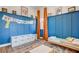 Bright bedroom with a playful design, featuring blue wainscoting, artwork, and a cozy layout at 10064 Ocher Valley Ave, Las Vegas, NV 89178
