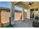 View of covered patio area complete with ceiling fan and neutral tones at 10064 Ocher Valley Ave, Las Vegas, NV 89178
