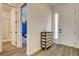 Inviting foyer with wood-look floors, white walls, and natural light at 10064 Ocher Valley Ave, Las Vegas, NV 89178