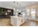 Bright kitchen featuring a center island, stainless steel appliances, and views into the backyard at 10064 Ocher Valley Ave, Las Vegas, NV 89178