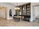 Spacious living room showcasing a dining area, built-in shelving, and modern decor at 10064 Ocher Valley Ave, Las Vegas, NV 89178