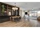 Stylish living room with a dining area, built-in shelving, and sliding glass doors to the backyard at 10064 Ocher Valley Ave, Las Vegas, NV 89178