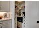 Walk-in pantry with shelving and storage, offering ample space for organizing groceries and kitchen essentials at 10064 Ocher Valley Ave, Las Vegas, NV 89178