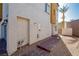 View of the home's backyard with brick-lined walkway leading to a fenced-in area at 10079 Dazzling Sunrays Ave, Las Vegas, NV 89129