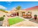 Outdoor living space with a patio, seating area, and easy-to-maintain landscaping at 1016 Wannamaker Way, Henderson, NV 89015