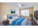 Cozy bedroom featuring a comfortable bed, natural light, and modern decor at 1016 Wannamaker Way, Henderson, NV 89015