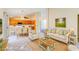 Open-concept living room flows into the dining area, creating a comfortable and inviting space at 1016 Wannamaker Way, Henderson, NV 89015