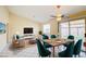 Bright living area with modern furniture and large sliding glass door that leads to the backyard at 1016 Wannamaker Way, Henderson, NV 89015