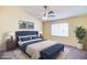 Comfortable main bedroom with a plush bed, ceiling fan, and ample natural light at 1016 Wannamaker Way, Henderson, NV 89015