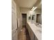 Bathroom featuring a double sink vanity and tile floors at 10215 Radcliffe Peak Ave, Las Vegas, NV 89166